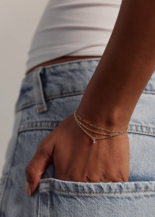 Delicate gold jewelry wrist chain.